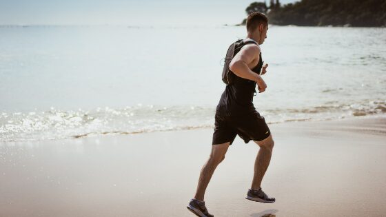 A man jogging by the beach