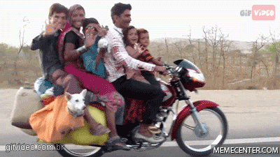 A big family sharing a motorbike